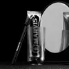 A black and white studio shot of a Marvis toothbrush and toothpaste in a glass, with a mirror reflecting the scene. Anteprima dell’immagine prodotto