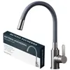 A kitchen faucet and its packaging are shown against a white background. Produktbild-Vorschau