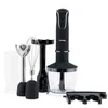 A set of kitchen appliances including a hand blender, whisk attachment, chopper attachment, and a measuring cup, arranged on a white background. Anteprima dell’immagine prodotto