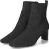 A pair of black knitted ankle boots with a patterned design and a block heel, presented on a white background. Produktbild-Vorschau