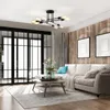 A modern living room with a sectional sofa, coffee table, and a stylish chandelier. Produktbild-Vorschau