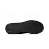 The sole of a black sneaker is shown against a white background. Voir les images du produit