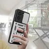 A hand holding a phone case with a ring holder, with a blurred indoor background. Produktbild-Vorschau