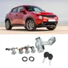 A red car is shown above a set of car ignition lock cylinders and keys. Podgląd zdjęcia produktu
