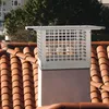 A chimney cap on a tiled roof. Anteprima dell’immagine prodotto