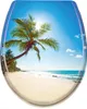 A toilet seat lid with a tropical beach scene printed on it. Náhled obrázku produktu