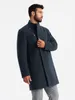A man wearing a dark blue coat and grey pants, posing against a white background. Anteprima dell’immagine prodotto