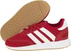A pair of red Adidas sneakers shown from a diagonal angle, with one shoe lying on its side and the other standing. Produktbild-Vorschau