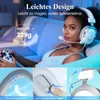 A woman wearing a white gaming headset is playing a video game. Produktbild-Vorschau
