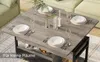 A dining table set up for a meal in a living room setting. Produktbild-Vorschau