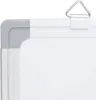 A close-up view of the corner and top edge of a whiteboard, showing the frame and hanging mechanism. Produktbild-Vorschau