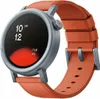A close-up shot of a smartwatch with an orange strap. Voir les images du produit