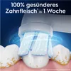 A close-up of an electric toothbrush head cleaning teeth, with promotional text overlayed. Náhľad obrázku produktu