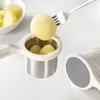 A potato masher is shown with cooked potatoes being prepared. Anteprima dell’immagine prodotto