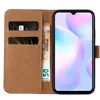 A brown flip-case wallet for a smartphone, with cards and banknotes inserted. Produktbild-Vorschau