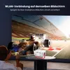 A person is using a projector to display a racing car on a large screen, with the projector placed on a coffee table. Produktbild-Vorschau