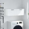 A white wall-mounted cabinet with two doors is shown above a white washing machine in a laundry room setting. Produktbild-Vorschau