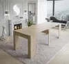 A dining table is set up in a luxurious living room with a fireplace and a sofa. Produktbild-Vorschau