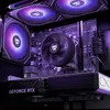 Close-up view of a gaming computer's internal components, including fans, graphics card, and motherboard, illuminated by purple LED lighting. Produktbild-Vorschau