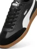 Close-up view of a black Puma sneaker with a white stripe and a brown sole. Produktbild-Vorschau