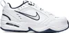 A white Nike Air Monarch IV shoe with navy accents, shown from the side against a white background. Produktbild-Vorschau