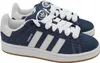 A pair of blue denim Adidas Campus 00s sneakers with white laces and white stripes. Náhled obrázku produktu