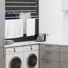 A laundry room with a drying rack, washing machines, and cabinets. Produktbild-Vorschau