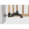 Close-up of a wooden child safety gate latch mechanism attached to a wall and the gate itself. Podgląd zdjęcia produktu