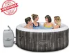 Four people are enjoying a hot tub outdoors. Produktbild-Vorschau