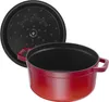 A red enameled cast iron pot with its lid slightly ajar, shown against a white background. Produktbild-Vorschau