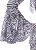 Close-up of a flared sleeve with a swirling pattern and sequins. Produktbild-Vorschau