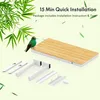A product shot of a desk with its components laid out, accompanied by bamboo leaves and a hummingbird. Produktbild-Vorschau