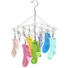 A stainless steel sock drying rack with multiple clips, holding several colorful socks. Produktbild-Vorschau