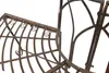 Close-up view of a metal garden bench with a curved design. Náhled obrázku produktu
