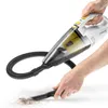 A person is using a handheld vacuum cleaner to clean up debris on a white surface. Anteprima dell’immagine prodotto