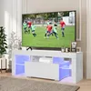A white TV stand with LED lighting is shown in a room with a television displaying a soccer game. Produktbild-Vorschau