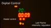 A close-up of a digital display on a heater control panel, showing temperature, timer, and flame intensity settings. Anteprima dell’immagine prodotto