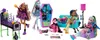 A group of Monster High dolls are displayed with their accessories, including a bed, a coffin-shaped locker, a couch, and a lamp. Náhľad obrázku produktu
