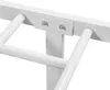 A close-up view of a white metal bed frame, showing the connection point between the horizontal top bar and a vertical support, secured with bolts and a metal plate. Produktbild-Vorschau