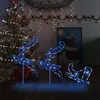 Christmas decorations including LED reindeer and a sleigh are displayed in front of a decorated Christmas tree and a painting of Santa Claus in a chimney. Náhľad obrázku produktu
