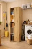 A laundry room or utility space with a cabinet, washing machine, and cleaning supplies. Anteprima dell’immagine prodotto