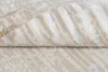 A close-up view of a folded rug with a geometric pattern. Produktbild-Vorschau