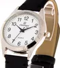 A close-up studio shot of a wristwatch with a black leather strap and a white face. Produktbild-Vorschau