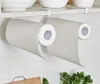 Two rolls of paper towels hanging from under a shelf in a kitchen. Podgląd zdjęcia produktu