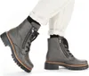A pair of grey women's boots worn with white trousers. Produktbild-Vorschau