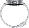 A side view of a silver smartwatch with a white band, isolated on a white background. Anteprima dell’immagine prodotto