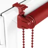 Close-up of a red roller blind mechanism attached to a white window frame. Produktbild-Vorschau