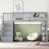 A grey loft bed with stairs and shelves in a child's room, decorated with a large teddy bear and a round chair. Produktbild-Vorschau