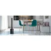 A modern kitchen or dining area with a table, chairs, and built-in seating. Anteprima dell’immagine prodotto