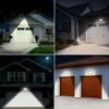 Collage of four images showing outdoor LED floodlights illuminating garages and houses at night. Produktbild-Vorschau